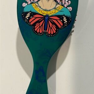NWOT Frida Kahlo Colorful Hairbrush with Butterfly Design.